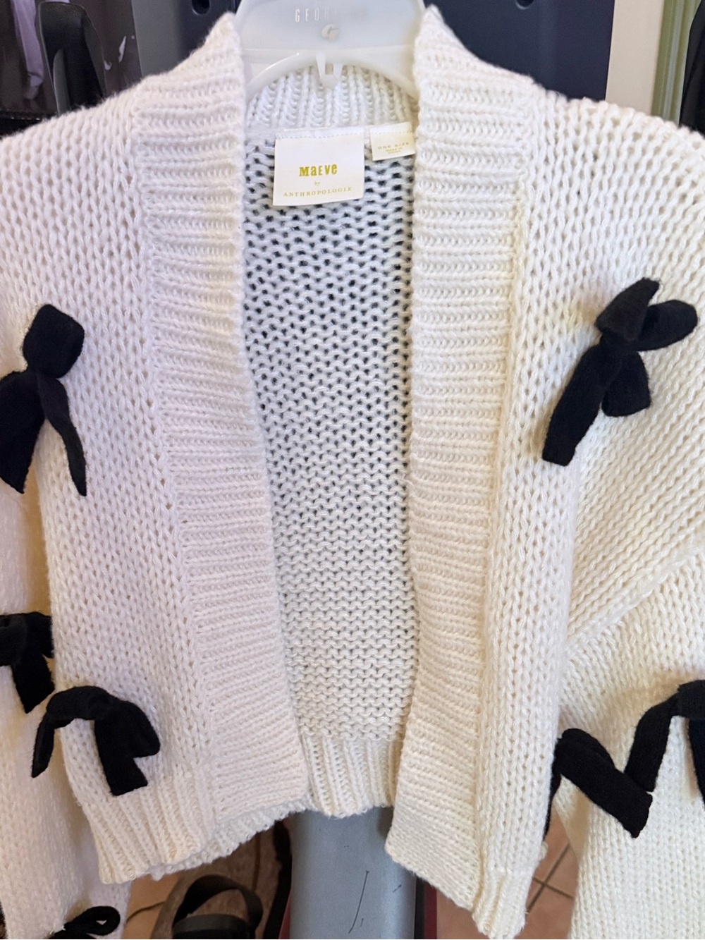 Suave Cream Knit Cardigan with Black Bow Accents